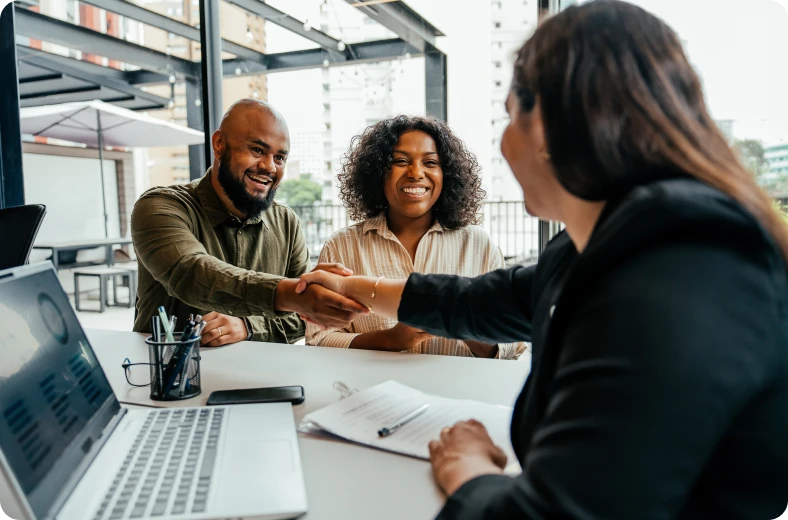 People shaking hands at a business meeting