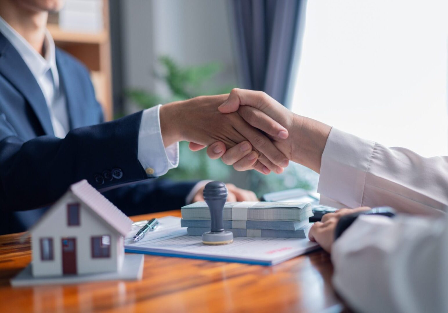 Real estate deal with handshake